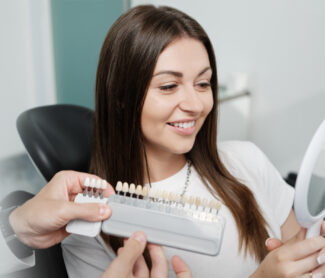 What happens to teeth under veneers